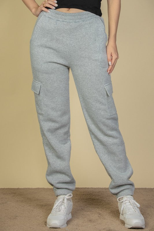 Heather grey sweatpants with side cargo pockets and elastic drawstring waist