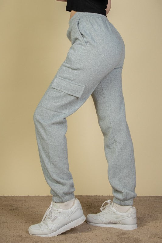 Heather grey sweatpants with side cargo pocket, drawstring waist and cuffed leg