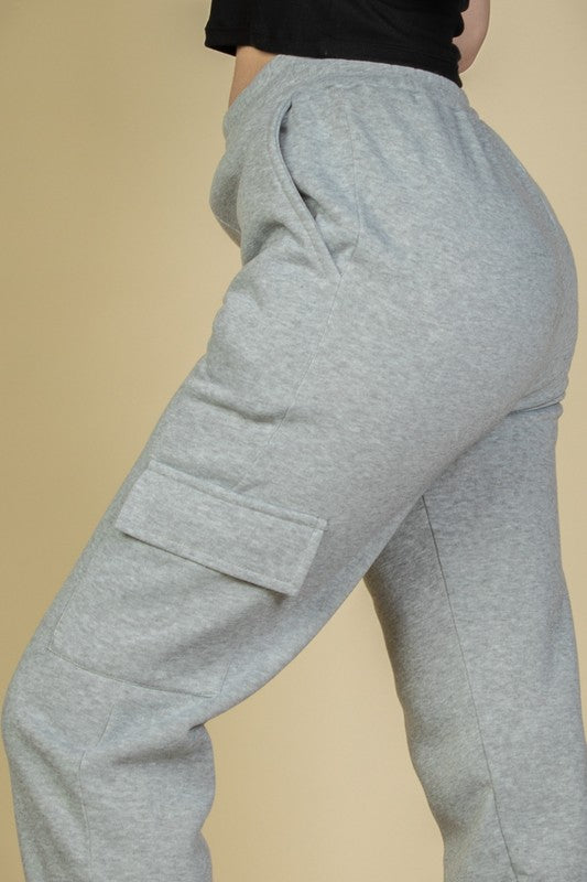 Heather grey joggers with cargo-style side pockets and drawstring waist