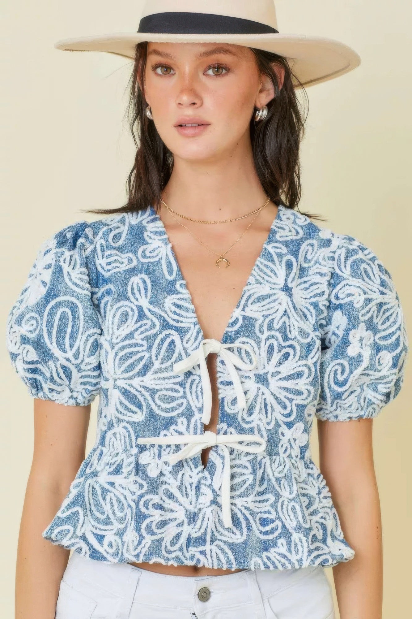 Embroidered blue/white floral crop top with puff sleeves and front tie detail