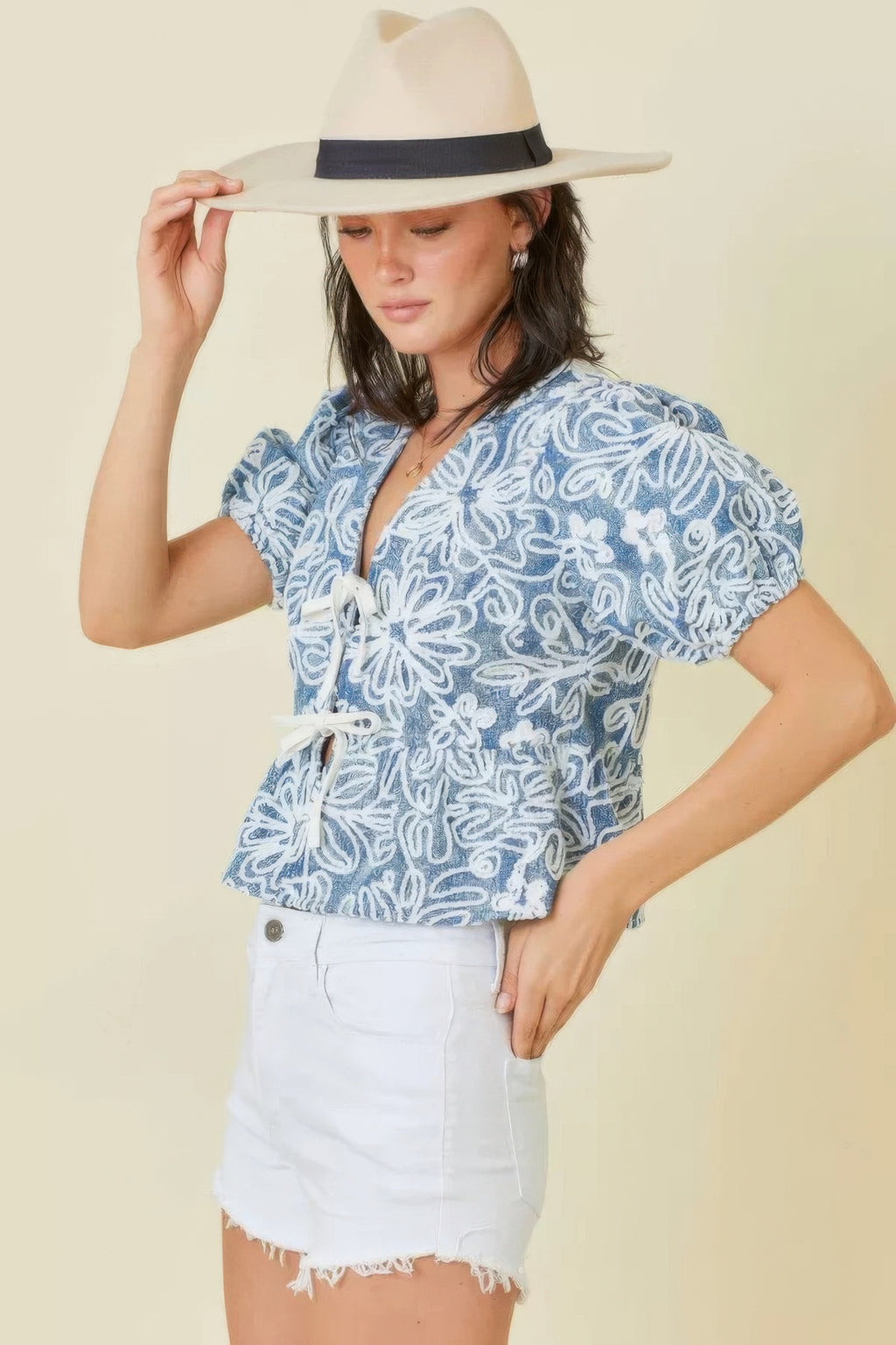 Blue/white floral embroidered crop top with V-neck and front tie detail