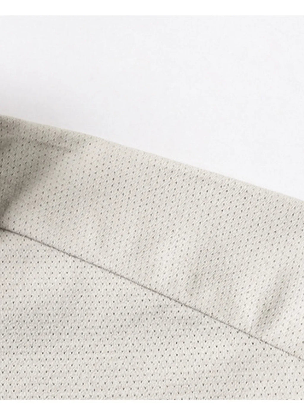 Mocha polo shirt collar seam and short-sleeve edge close-up