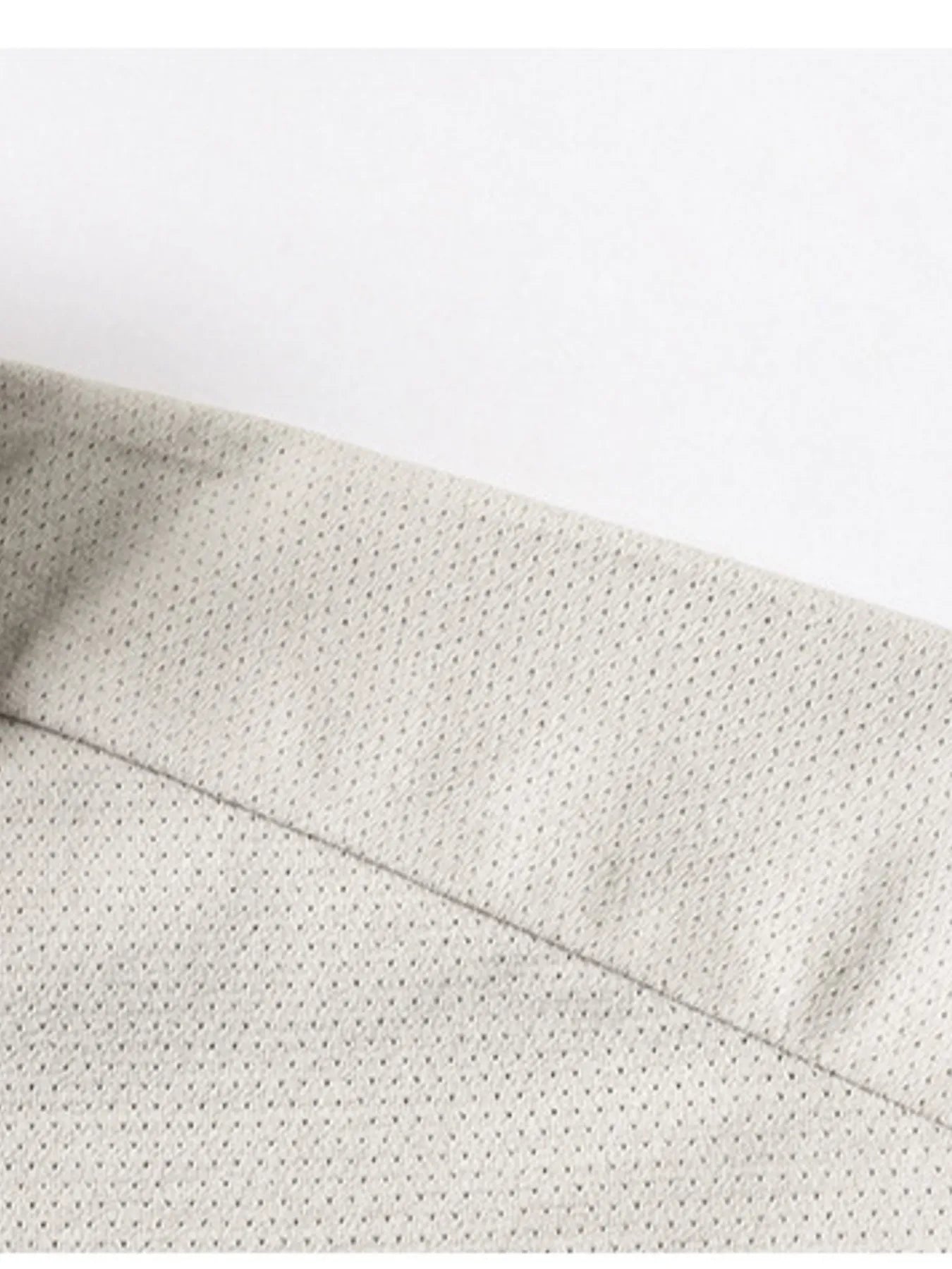 Mocha polo shirt collar seam and short-sleeve edge close-up
