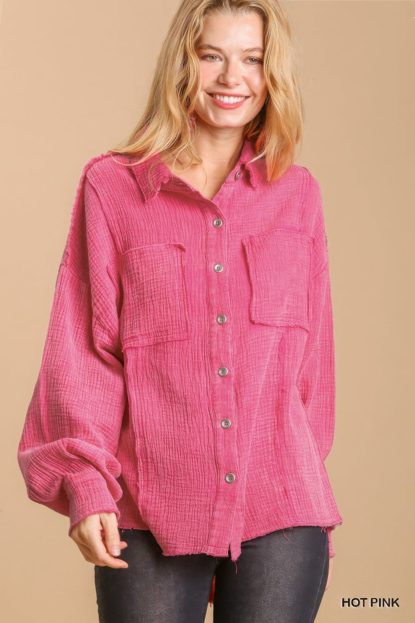 Hot pink button-down top with chest pockets and long sleeves