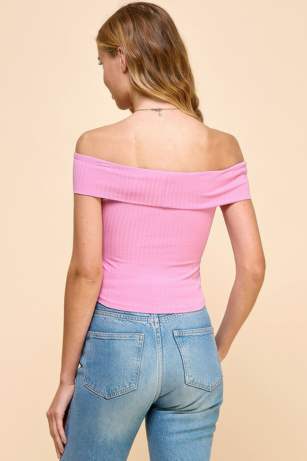 Back view of Aurora Pink off-shoulder ribbed top with wide elastic neckline