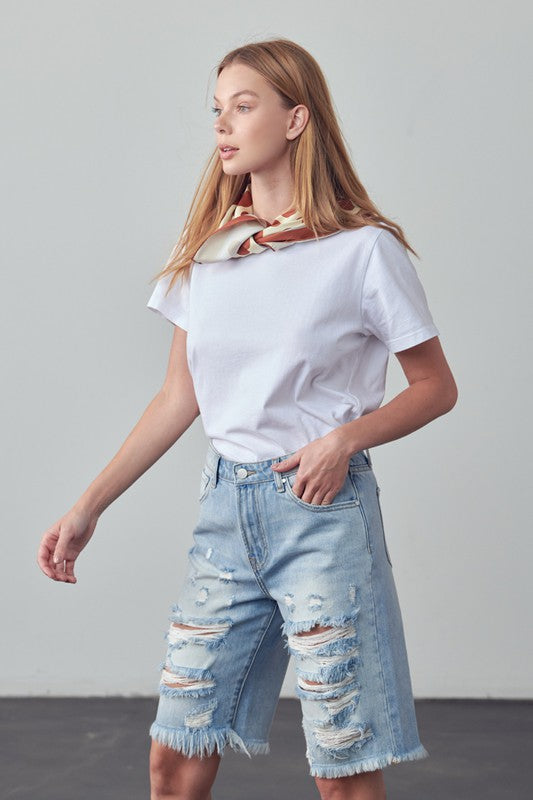 High-rise ripped bermuda denim shorts, distressed patches and frayed bottom edge