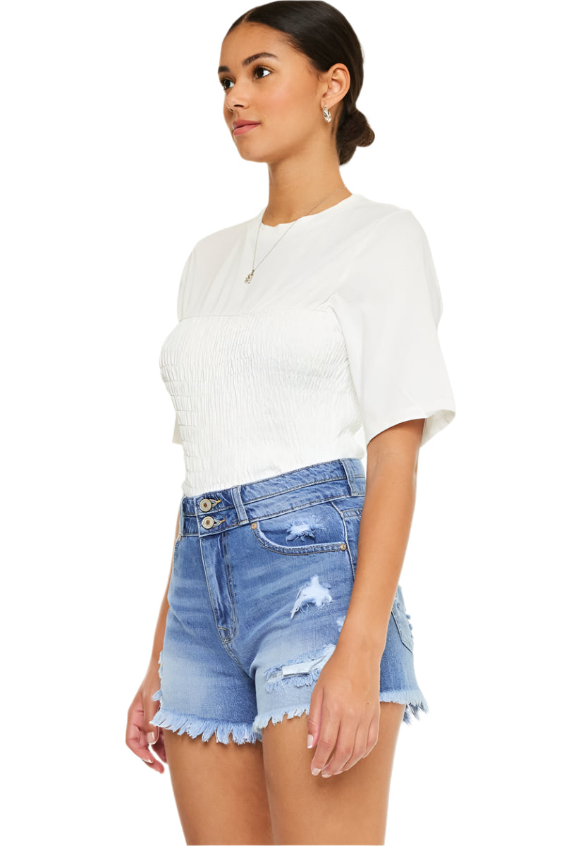 High-rise blue denim jean shorts with frayed hem and back patch detailing