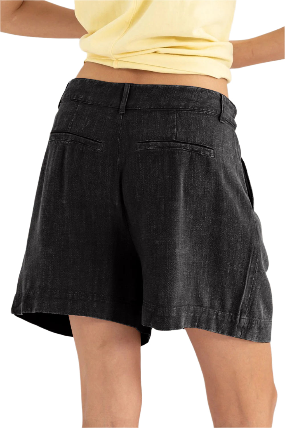 Black high-waist pleated linen shorts, size M, model wearing front view