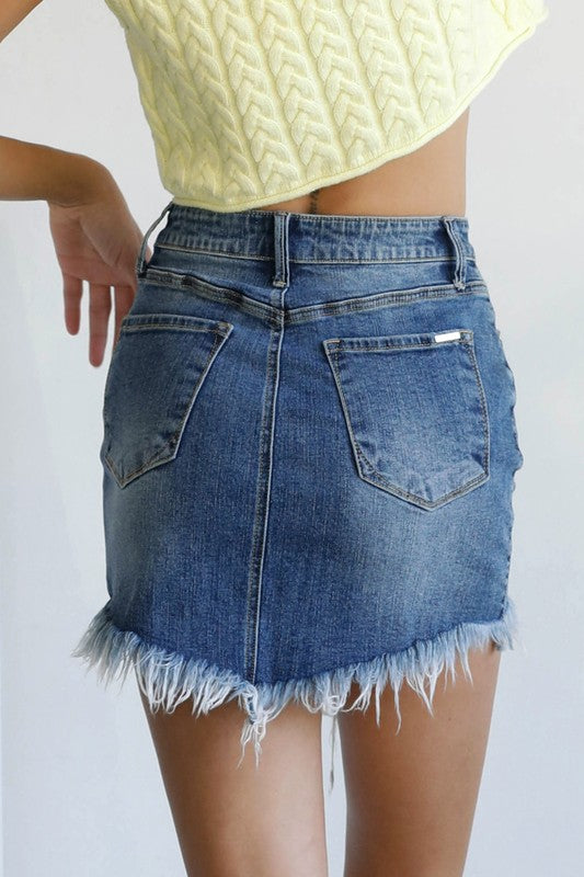High-waist medium-wash denim mini skirt, frayed hem and back yoke seam