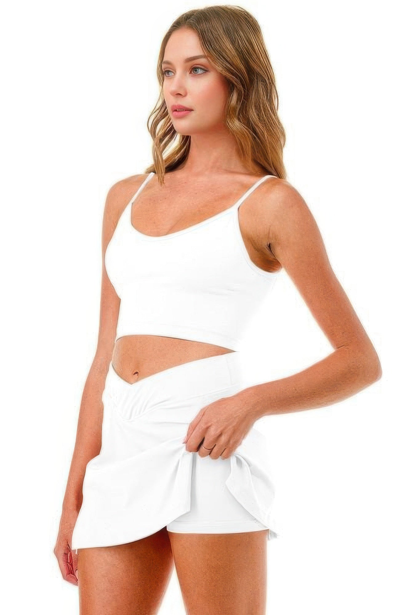White tennis/pickleball skort with built-in shorts, sleeveless crop top look