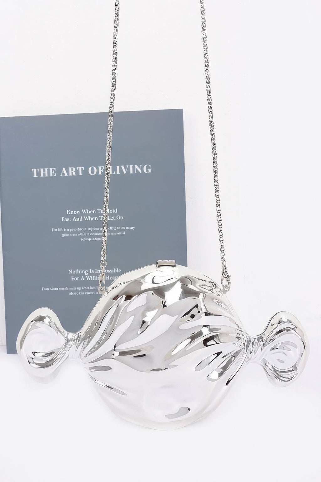 Silver acrylic fish bag with long chain strap and top clasp, rounded fin detail