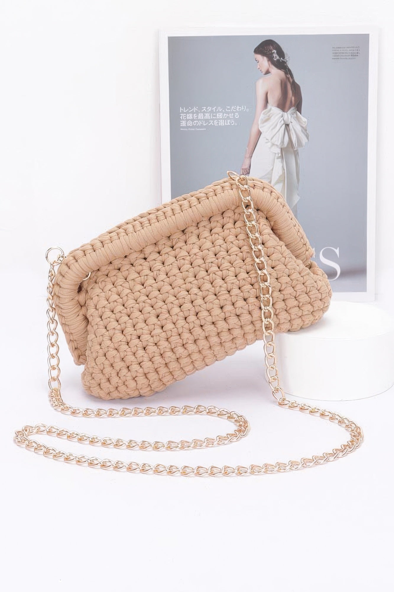 Beige cotton braided clutch with gold-tone chain and ring clasp