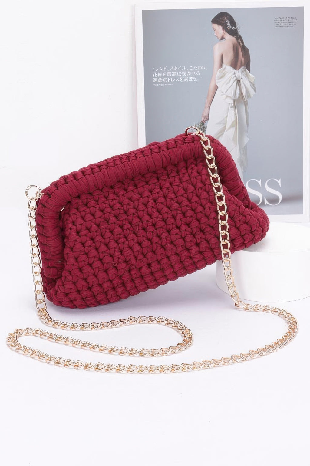 Burgundy cotton braided clutch with gold-tone chain strap and ring closure