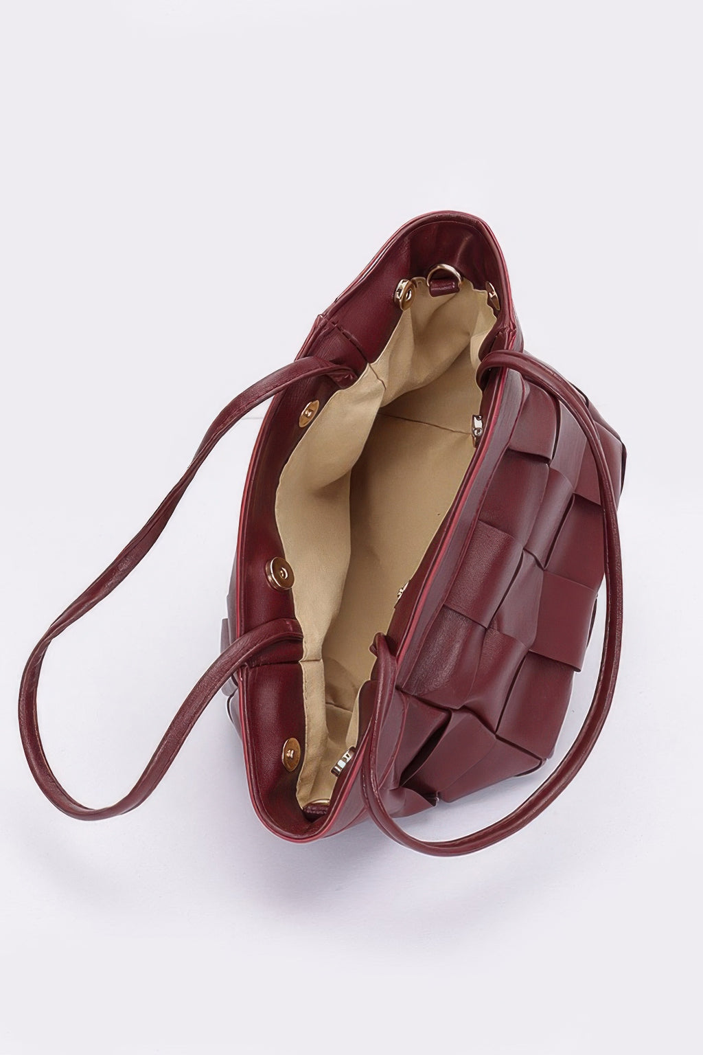 Burgundy faux leather tote bag open view with beige lining and gold-tone hardware