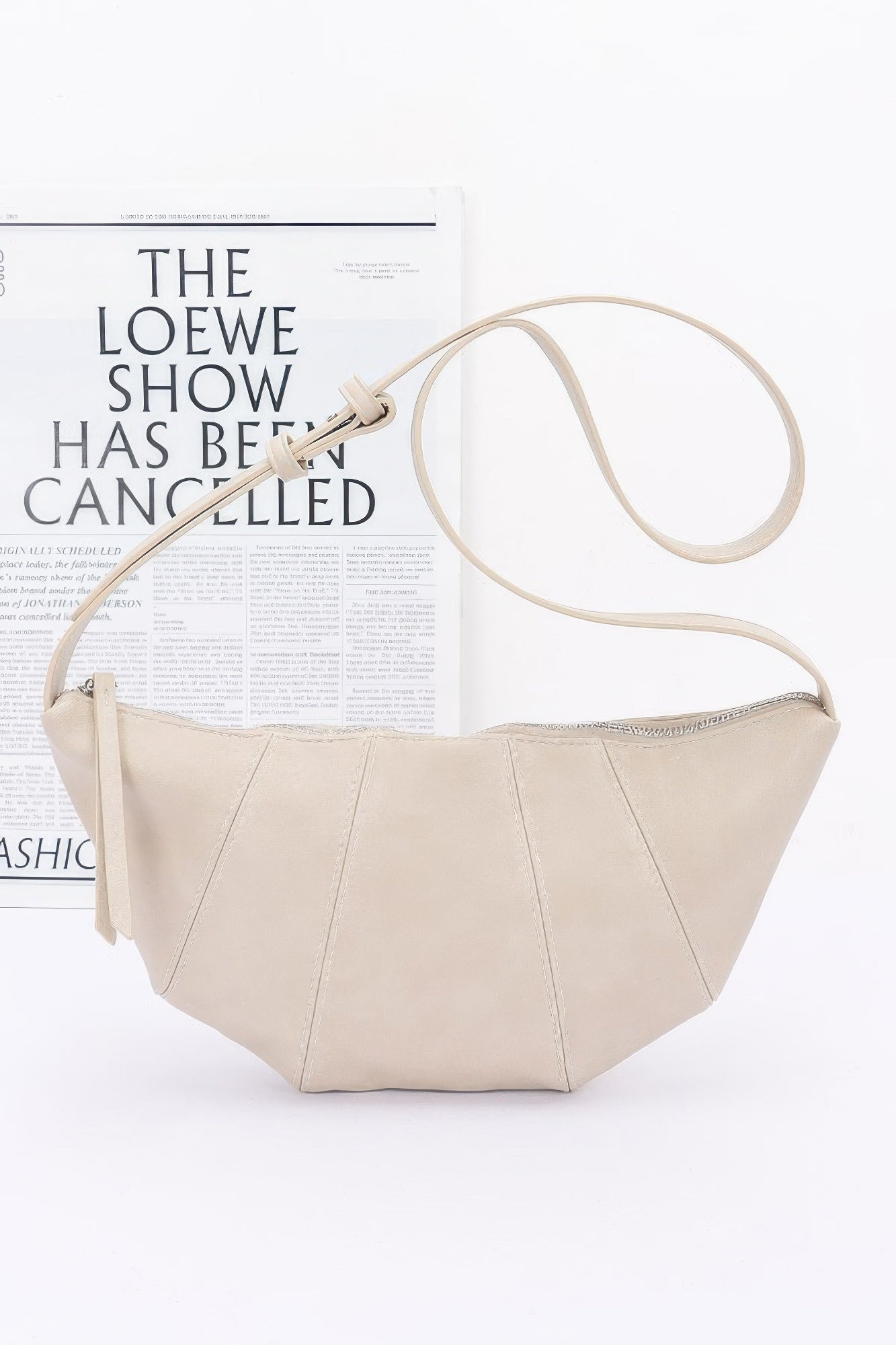 Tigbul's Variety Fashion Shop cream faux leather croissant bag with zip-top and strap