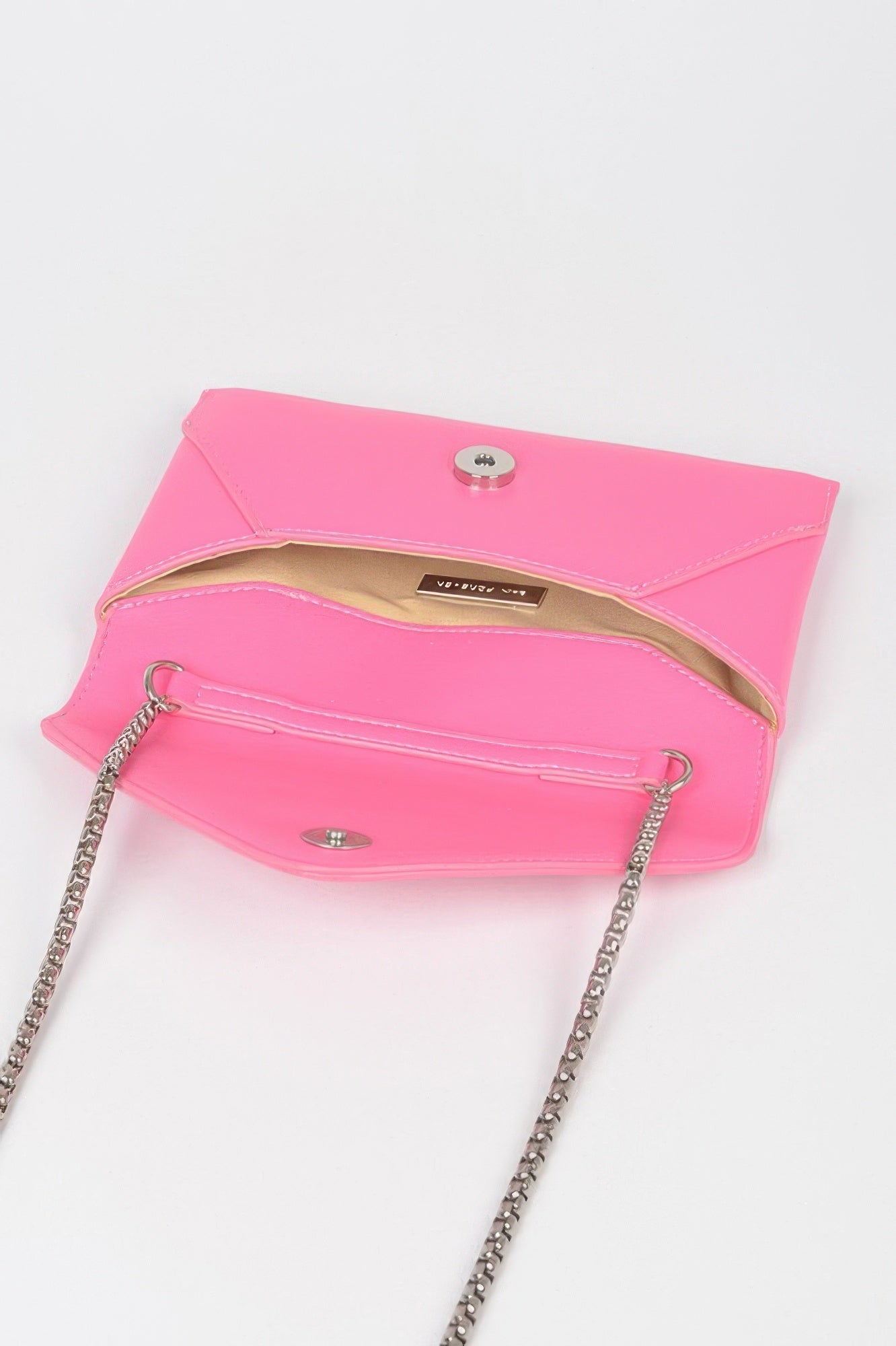 Fuchsia small envelope clutch with snap closure; chain and shoulder strap attached
