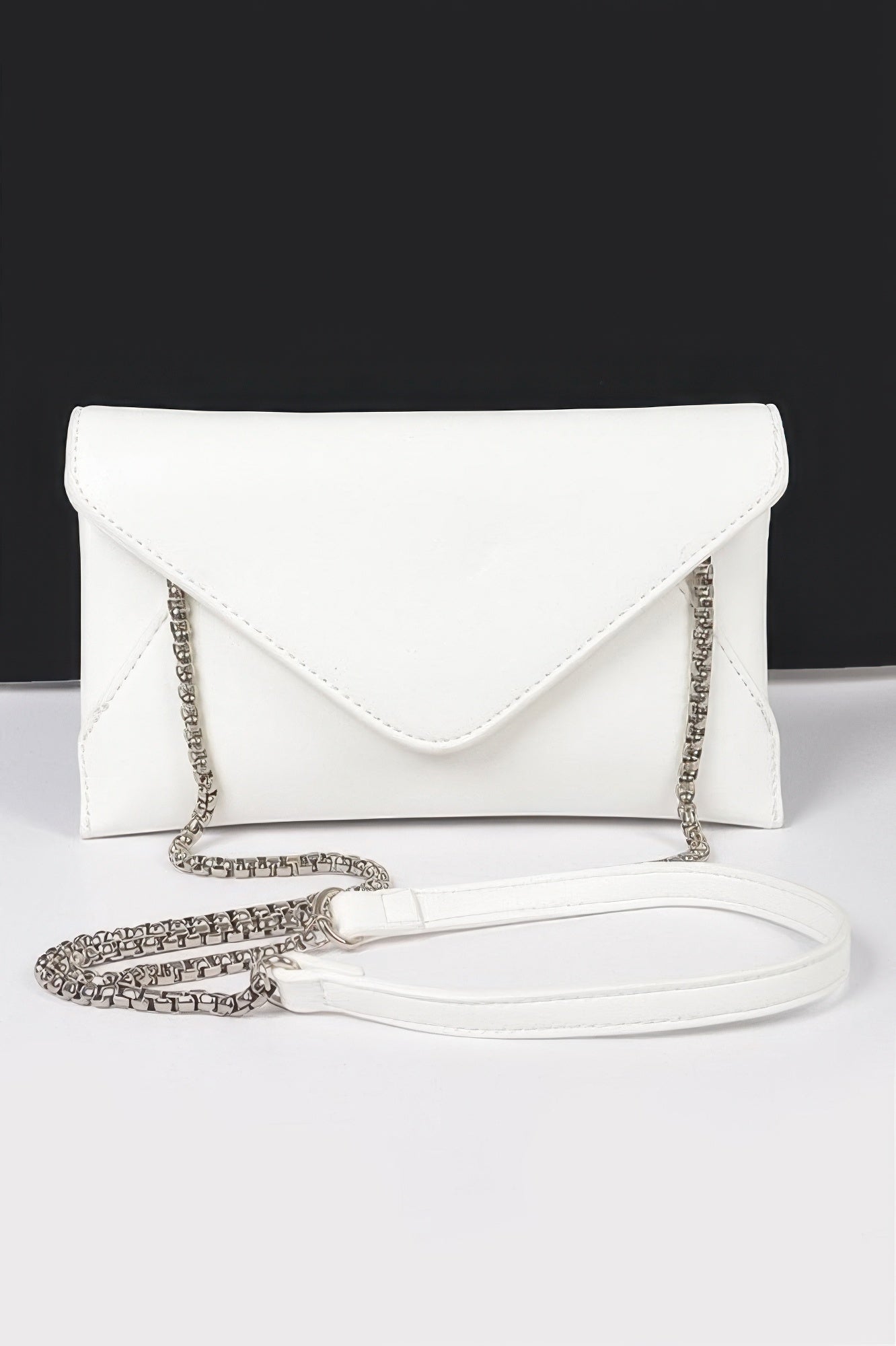 White faux leather small envelope clutch with chain strap and white shoulder strap