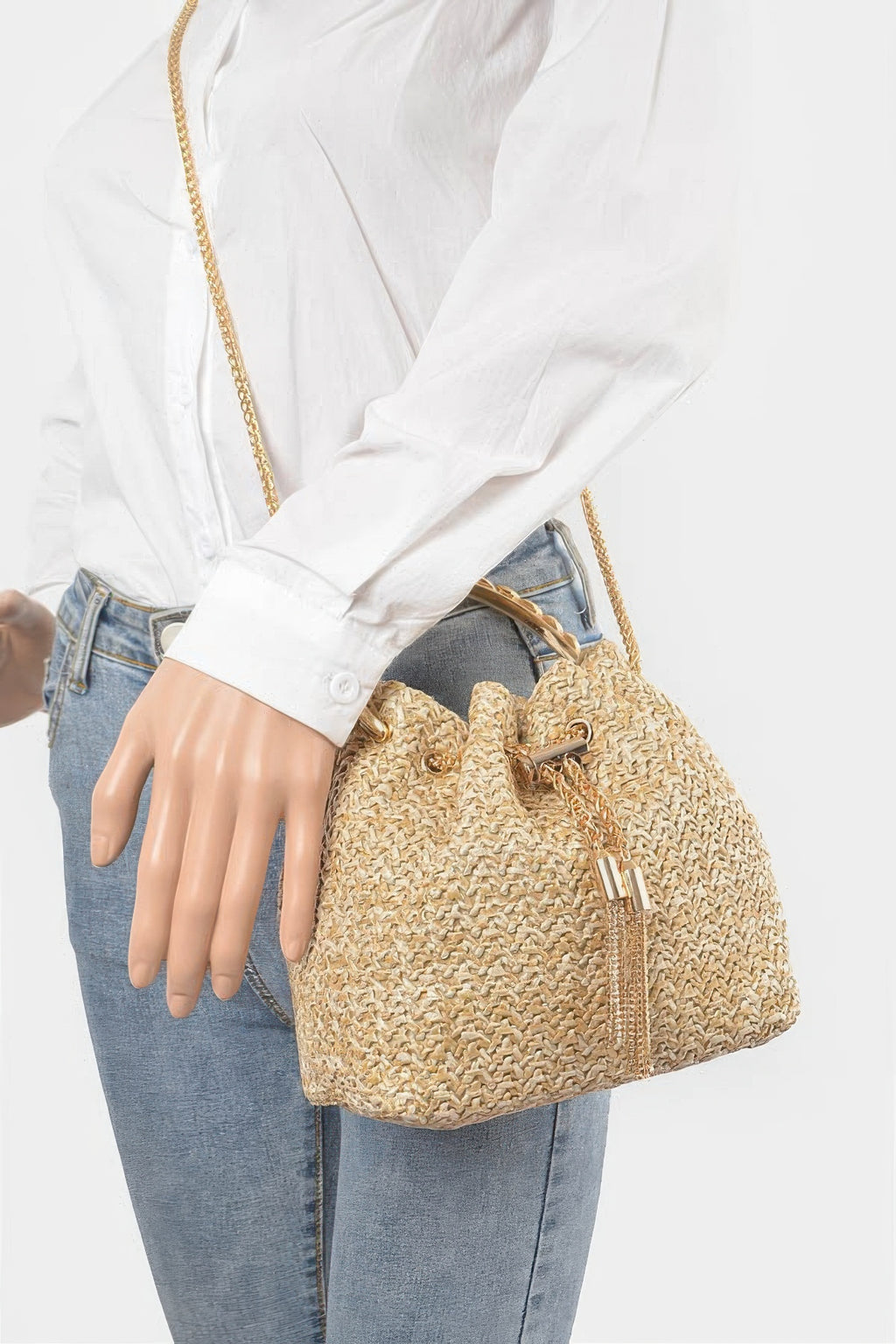 Worn faux straw bucket bag, natural woven texture, gold chain shoulder strap