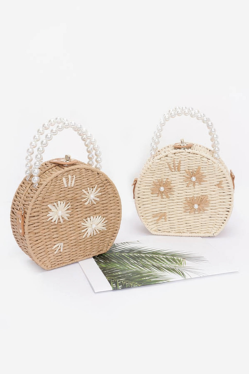 Two-tone faux straw clutches with pearl handles: khaki and ivory, white flower appliqués