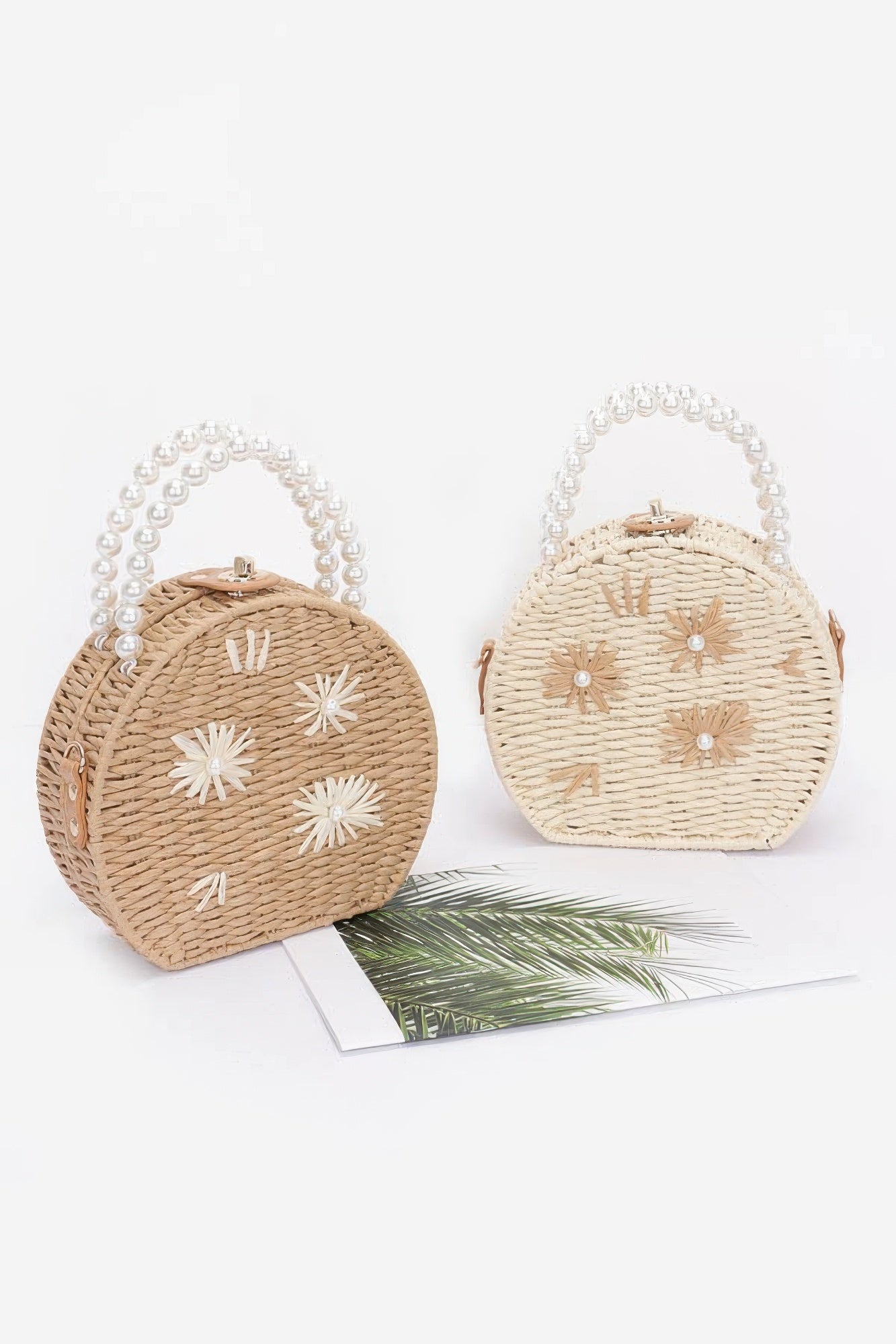 Two-tone faux straw clutches with pearl handles: khaki and ivory, white flower appliqués