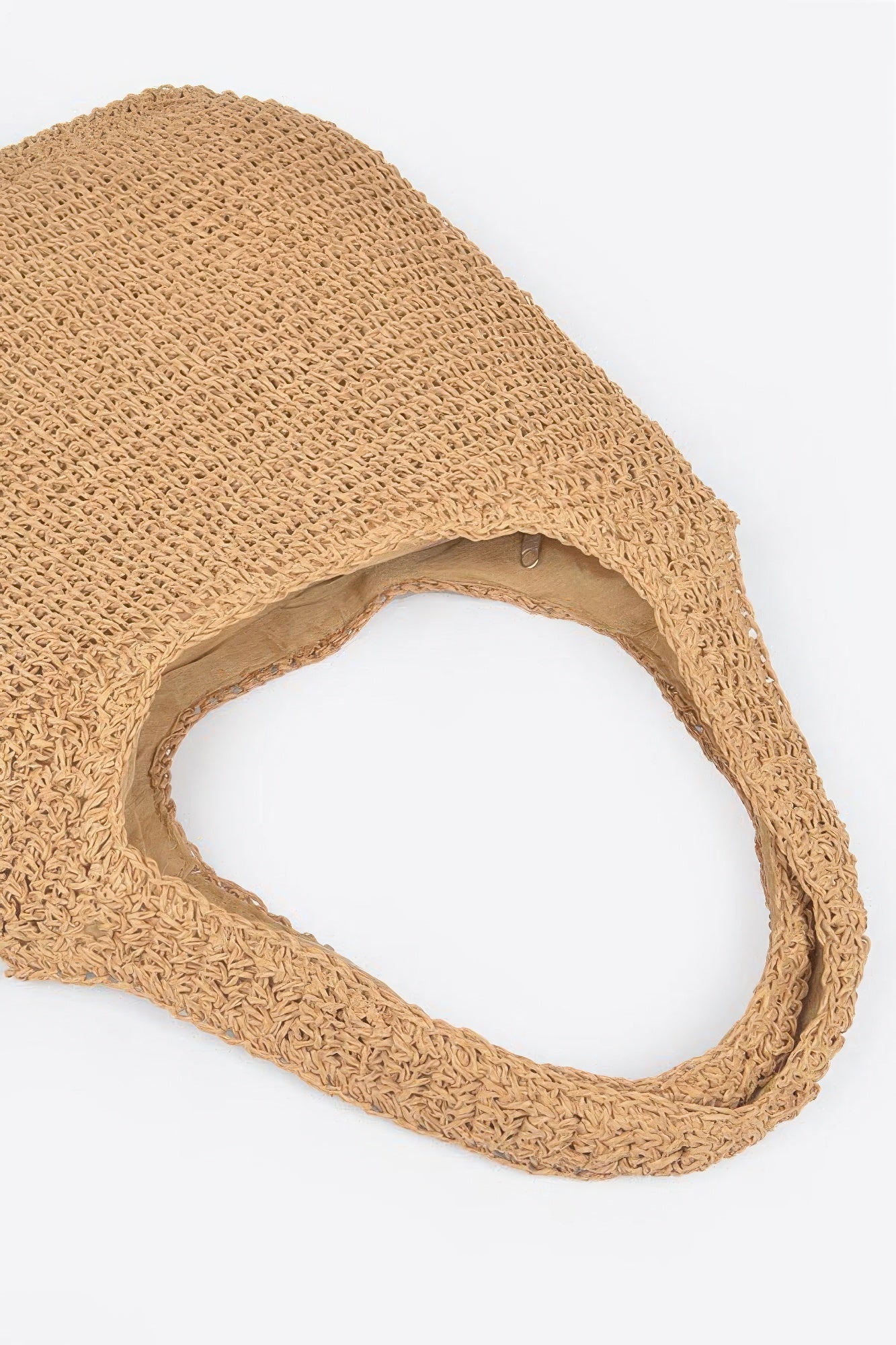 Faux straw hobo bag close-up of woven fabric and oval handle opening