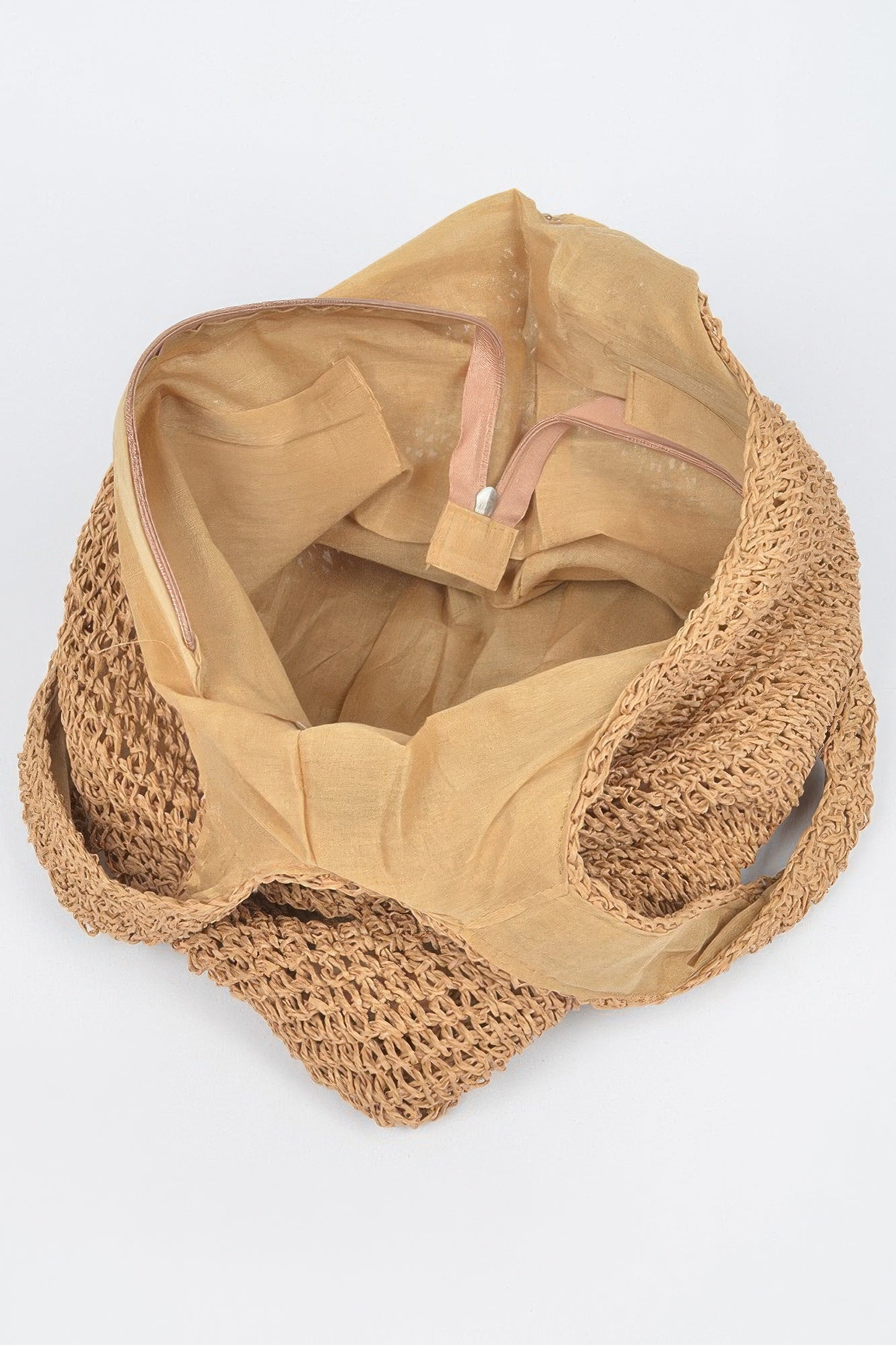 Faux straw hobo bag interior lining visible through wide opening