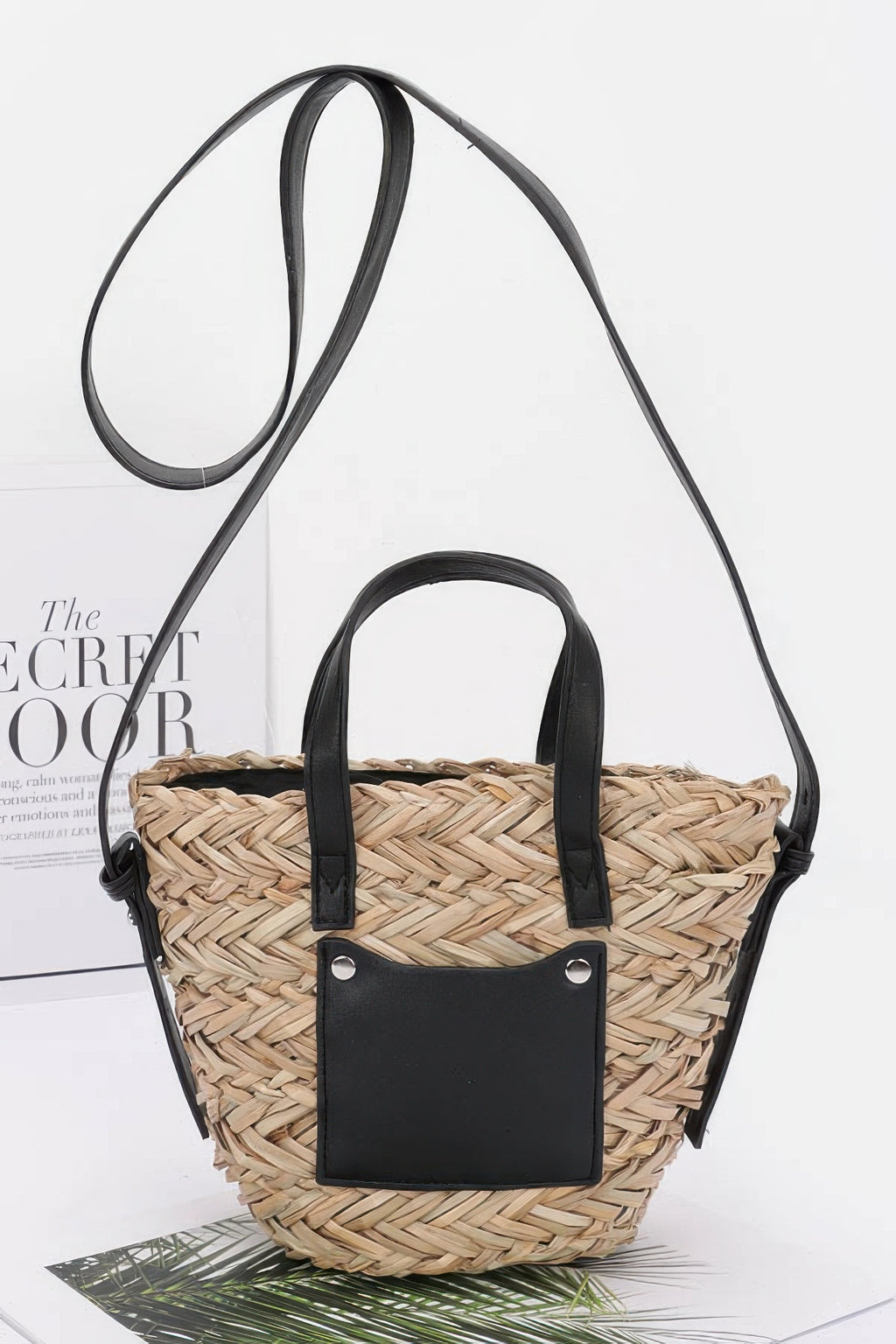 Faux straw small tote bag in black with woven basket weave and front leather pocket