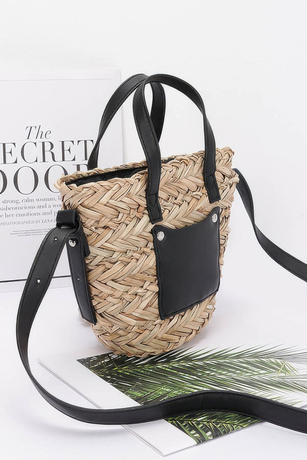 Camel faux straw small tote with black leather pocket, twin handles, and long strap