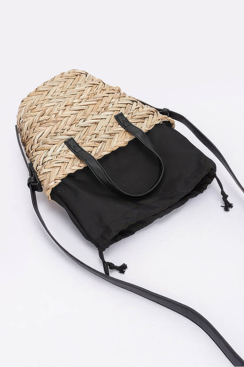 Camel faux straw small tote with black drawstring top and tassel cords on crossbody