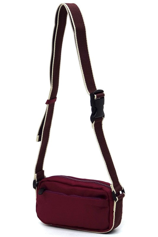 Deep purple nylon crossbody fanny pack, adjustable shoulder strap and front zip pocket