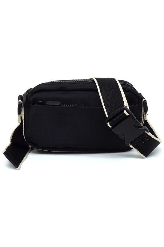 Black nylon crossbody fanny pack with front zip, D-ring ends, and adjustable strap