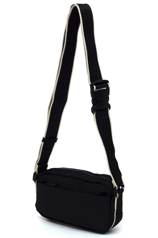 Black nylon crossbody fanny pack with adjustable strap and front zip pocket