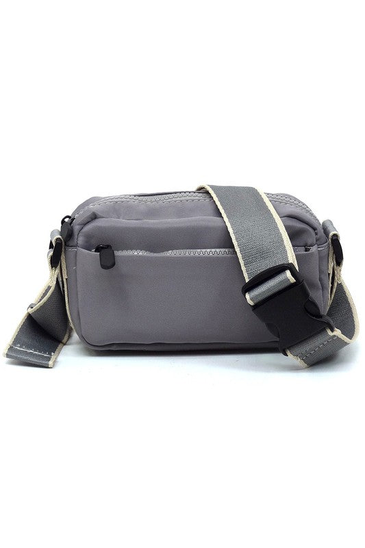 Grey nylon crossbody fanny pack with front zip and adjustable shoulder strap