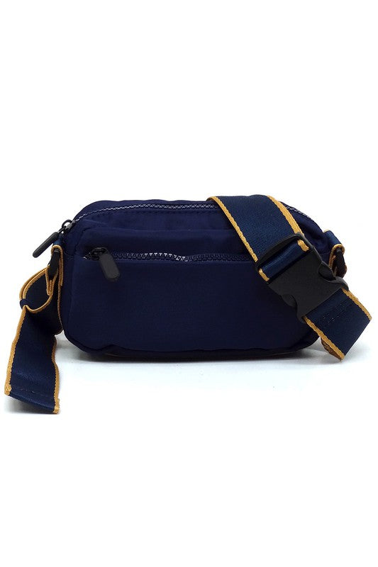 Navy nylon crossbody fanny pack with front zip, contrast trim, and adjustable strap