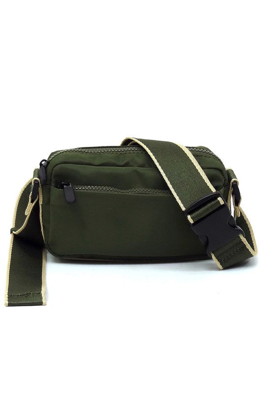 Olive green nylon crossbody fanny pack with front zip and adjustable shoulder strap
