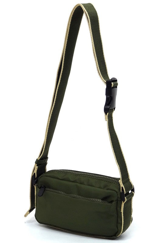 Olive green nylon crossbody fanny pack with adjustable strap and front zip pocket