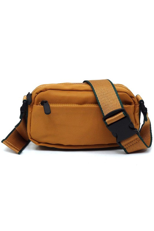 Nylon fanny pack crossbody bag, tan with dark front zipper pocket and teal strap