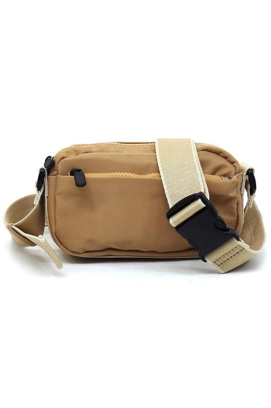 Nylon fanny pack crossbody bag in tan with front zipper pocket and beige adjustable strap