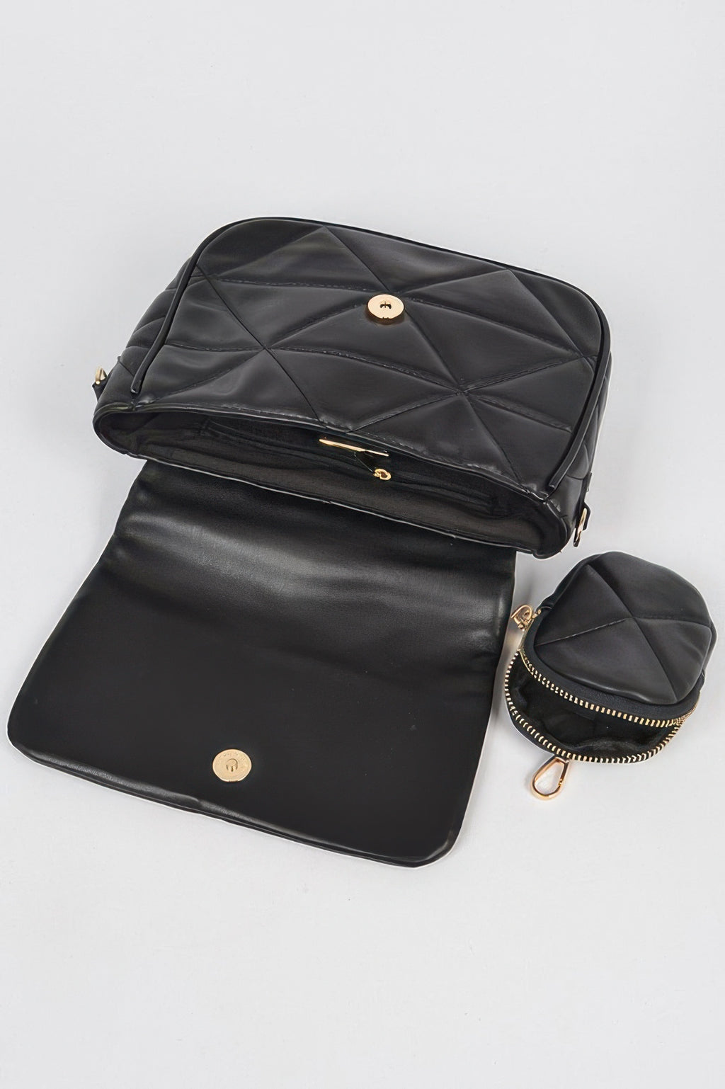 Black quilted crossbody set with long strap, flap front, and small round pouch