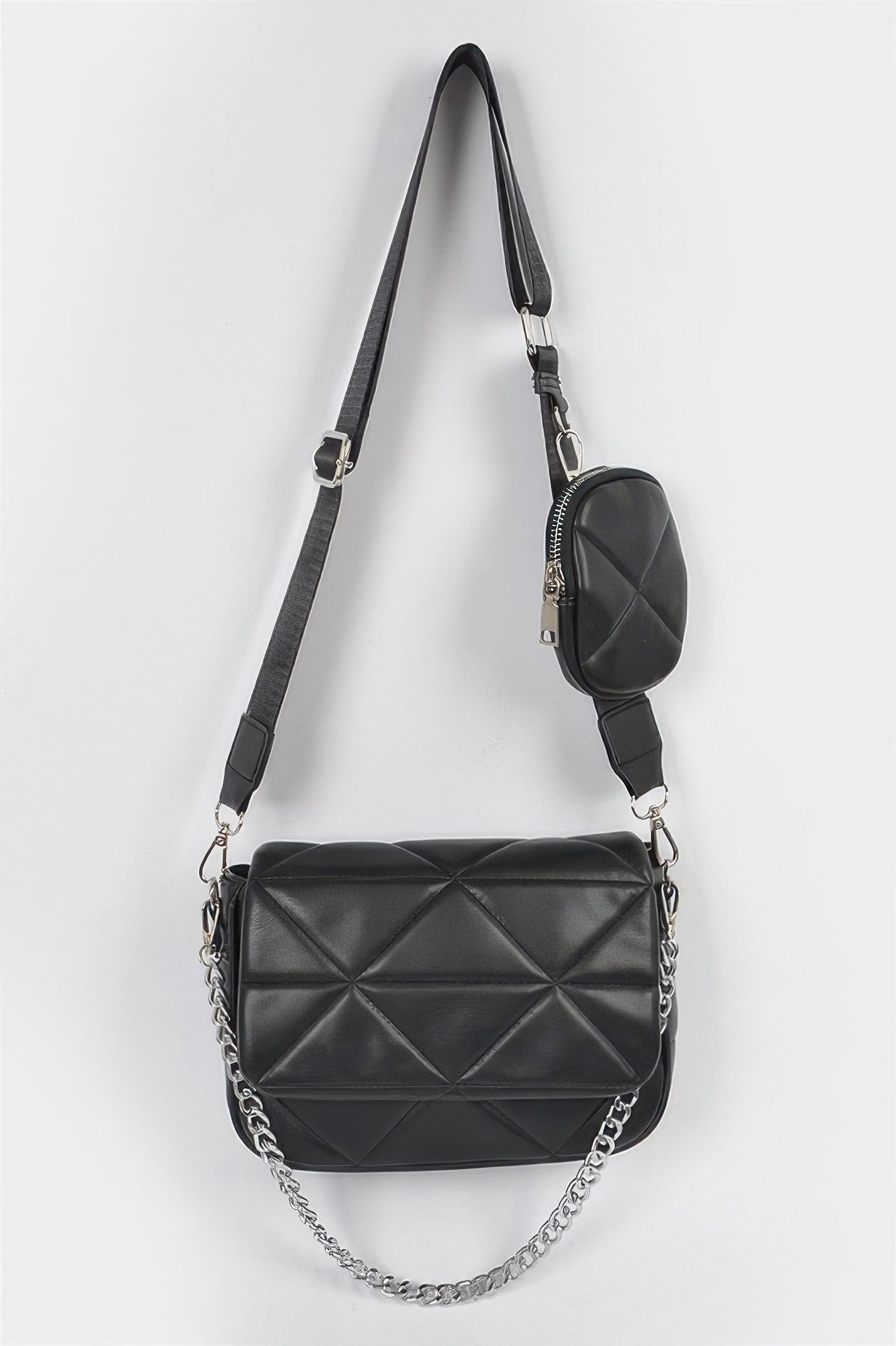 Quilted black crossbody bag with silver chain strap and flap front