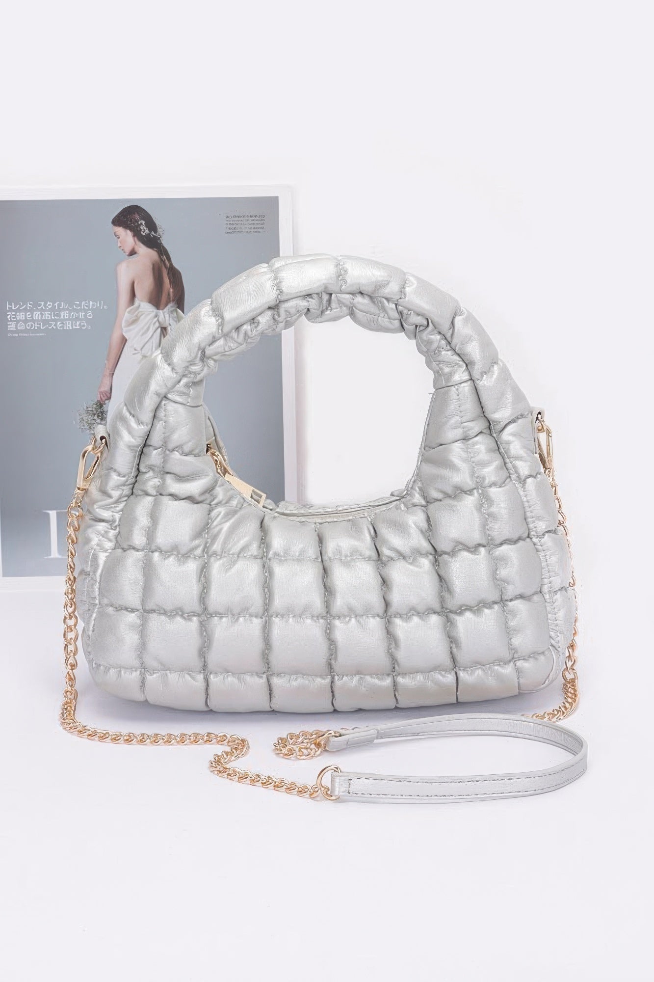 Silver quilted faux leather padded hobo bag with chain strap and adjustable wrist strap