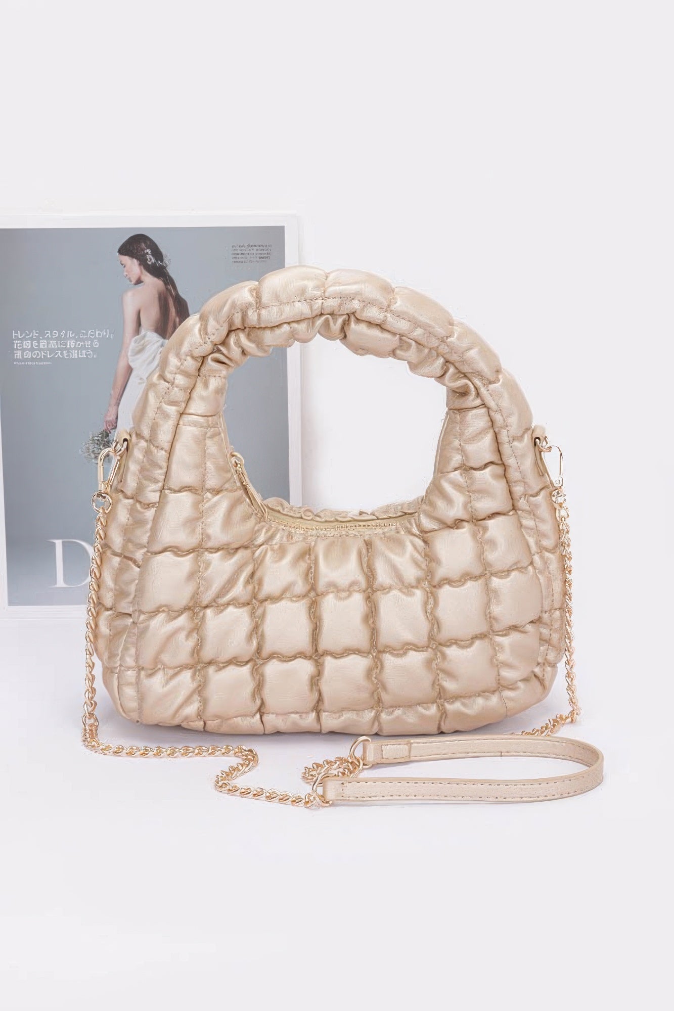 Gold-beige quilted faux leather padded hobo bag with chain strap and zipper opening