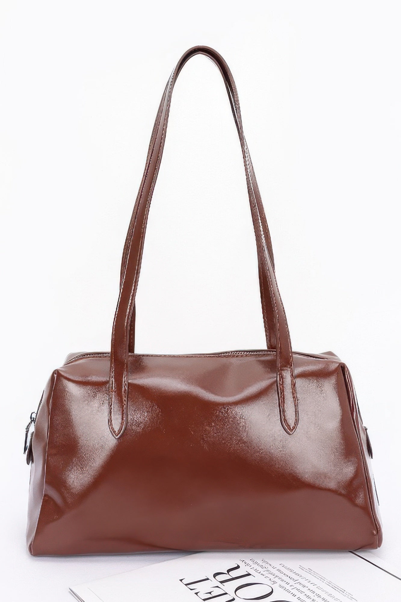 Shiny faux leather sport handbag in brown, top handles and front zipper pocket