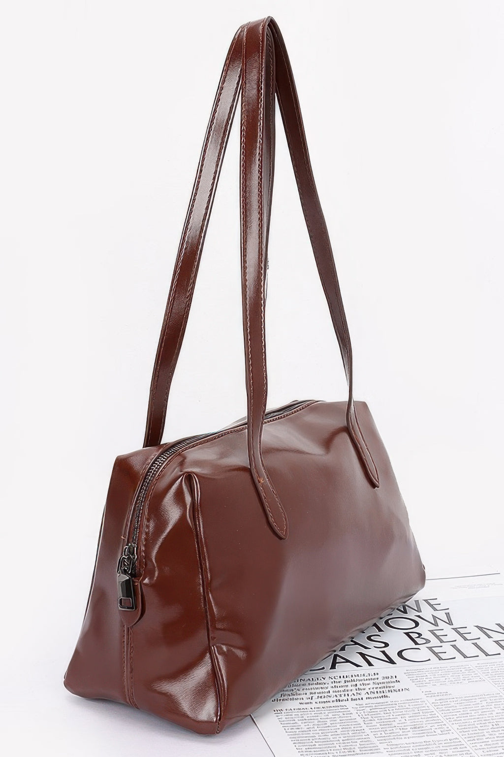 Shiny faux leather sport handbag in brown, side view with double top handles