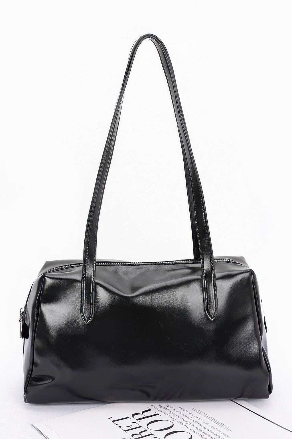 Shiny faux leather sport handbag in black, tall handles and front zipper pocket