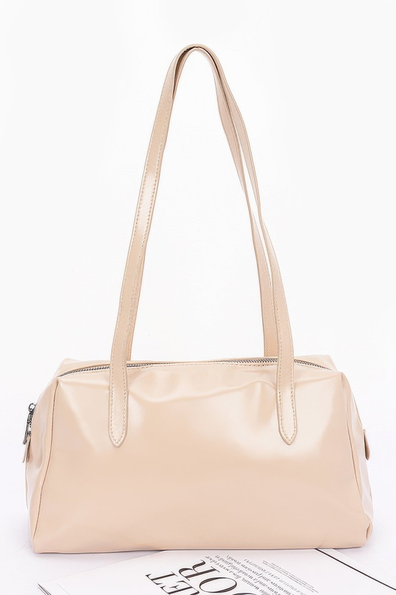 Shiny faux leather sport handbag in beige, top handles and side zipper details