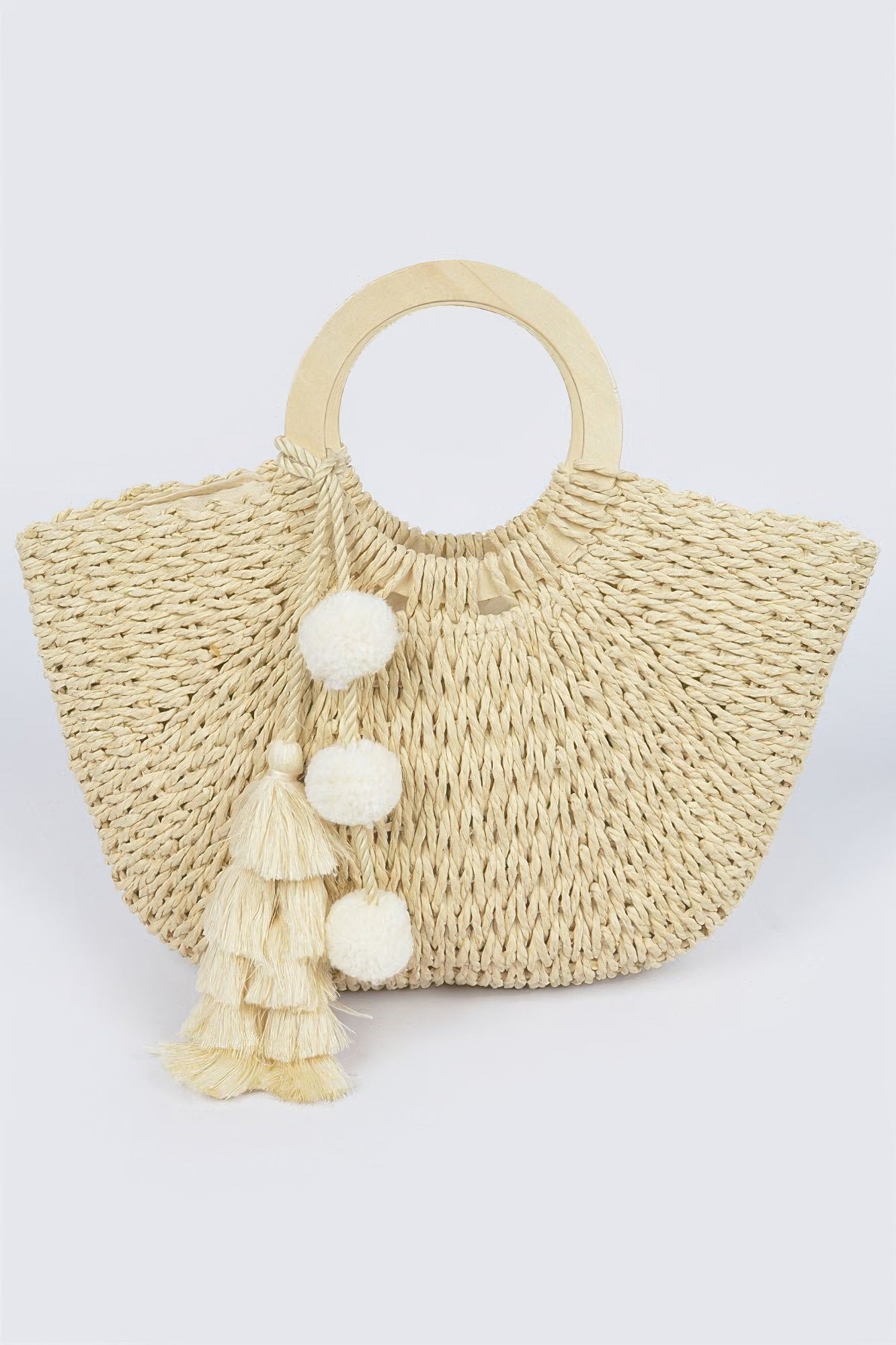 Woven cotton tote bag with wood handle, cream tassel pom‑poms, ivory