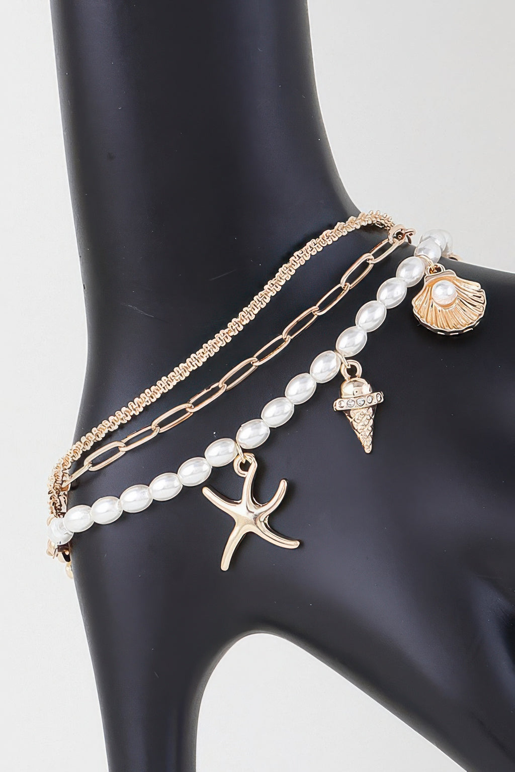 At The Beach multi charm bracelet with pearl beads and starfish, shell, anchor charms