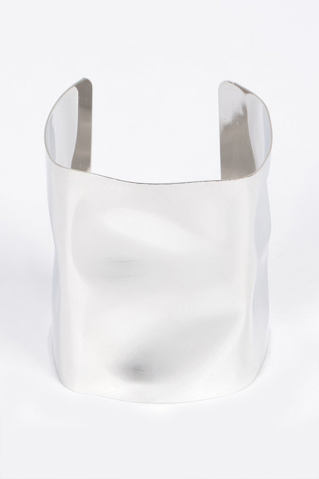 Silver-tone metal cuff bracelet, wide open design with polished curved finish