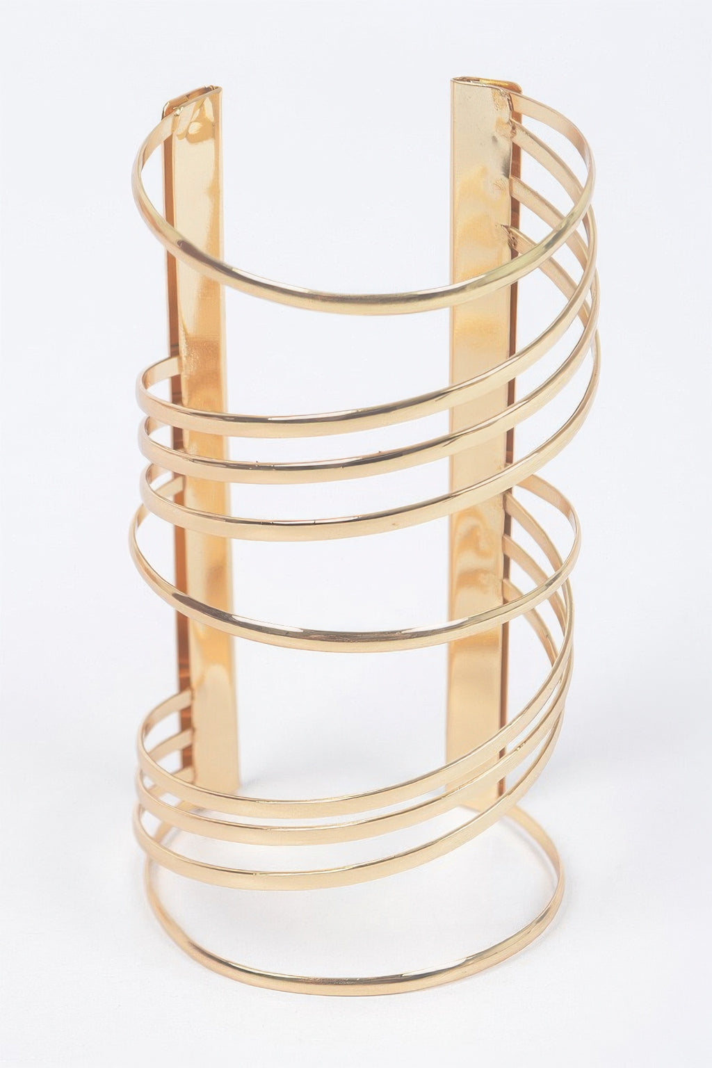 Gold cuff bracelet with wide vertical plate and multiple horizontal metal loops
